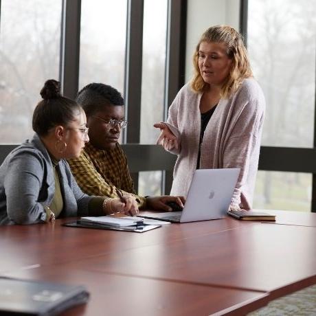 Three students at laptop