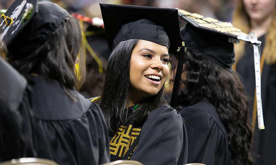 Graduating FSU students. One student looking back.